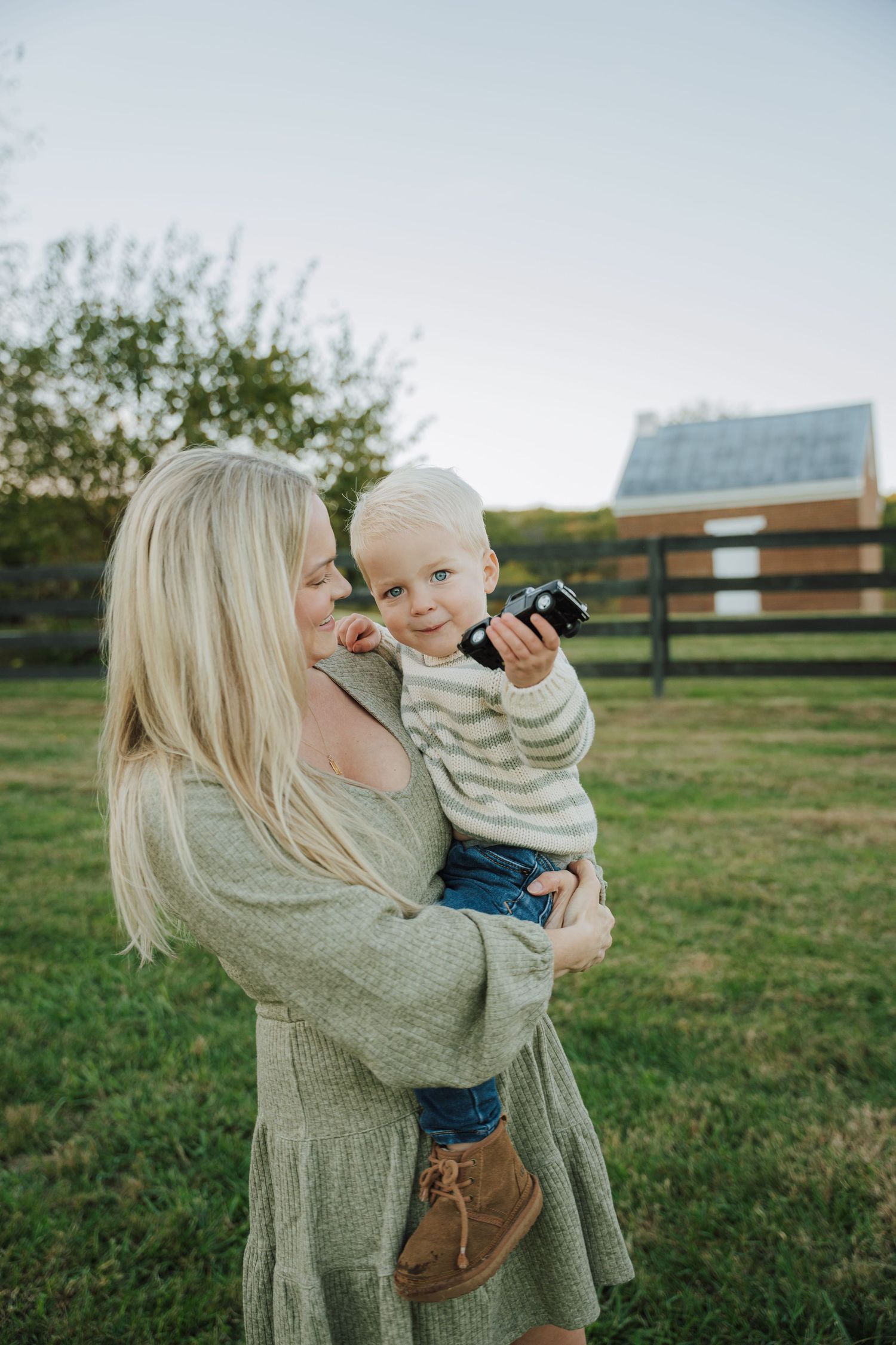 a mom holding her baby son