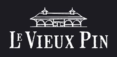 Le Vieux Pin winery logo featuring a white illustrated building on a dark background with elegant serif typography.