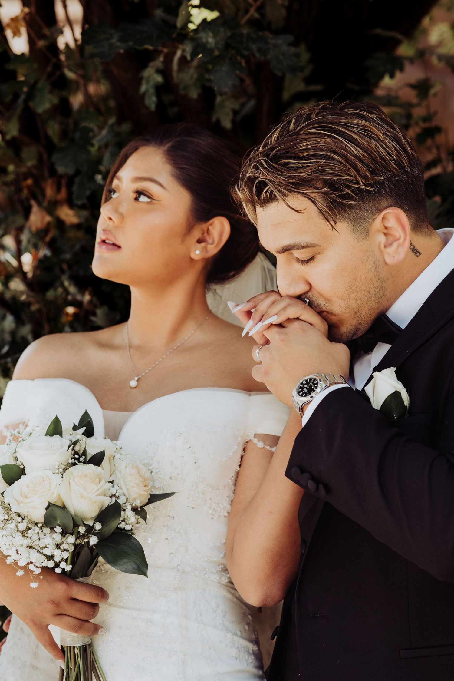 A series of romantic wedding photos showing intimate moments between a newlywed couple with white bouquet details.