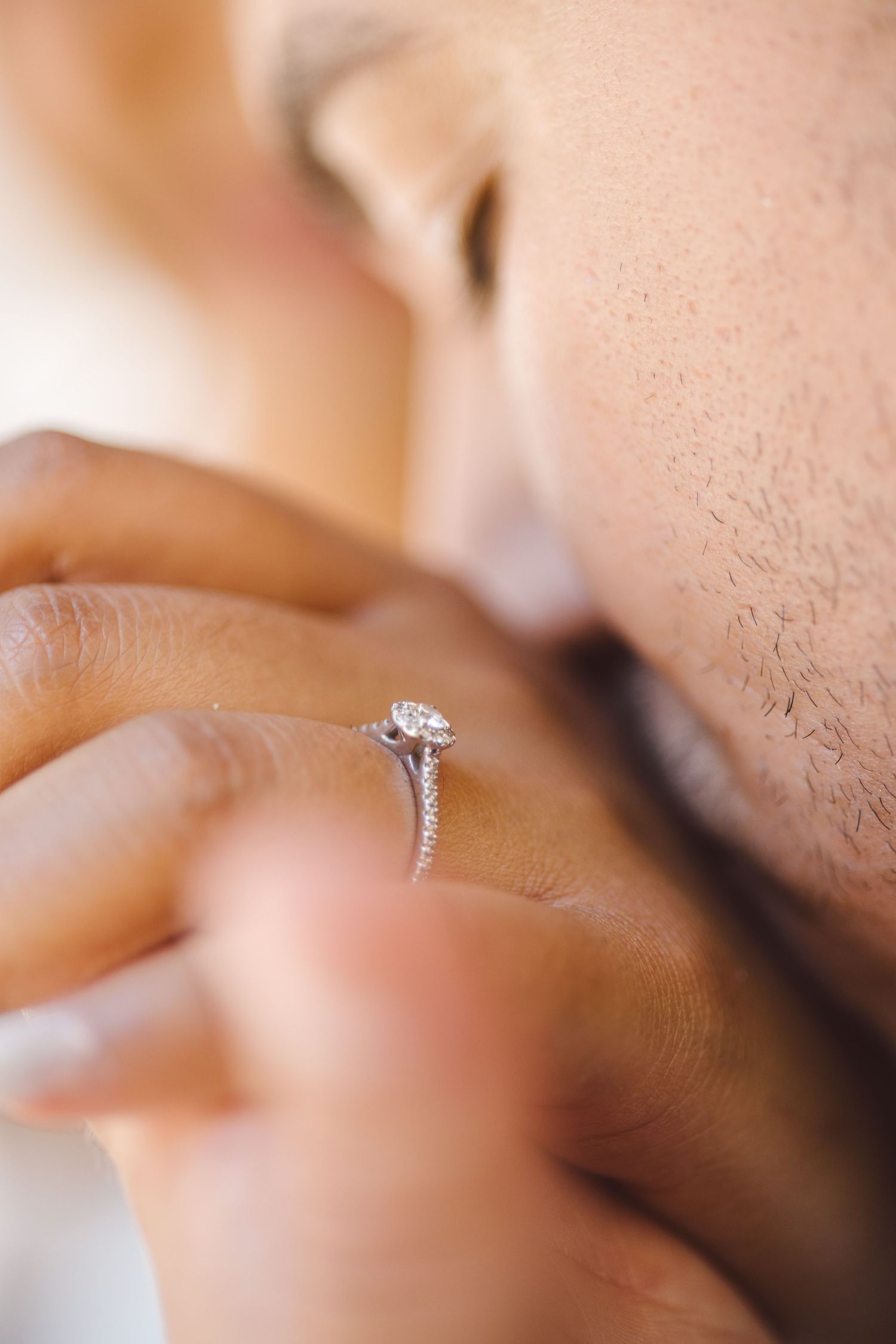 Close-up series of engagement ring photos showing a diamond solitaire in white gold setting from multiple angles.