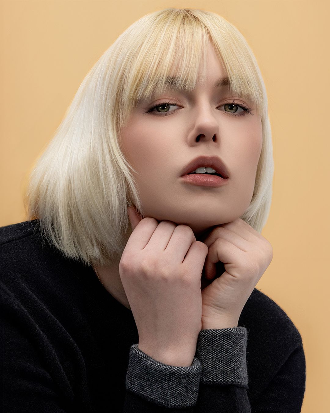 A series of minimalist portrait photos showing a blonde bob hairstyle against a neutral background.