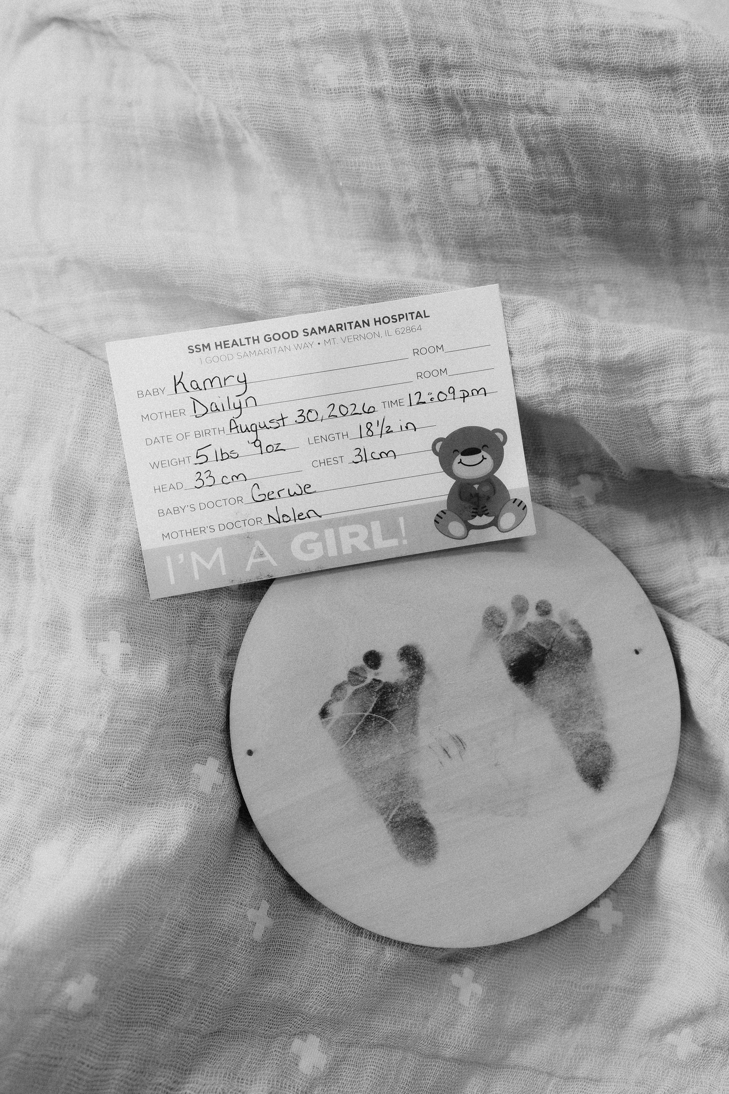 Black and white photo of newborn girl birth certificate card with footprint keepsake from SSM Health Good Samaritan Hospital.