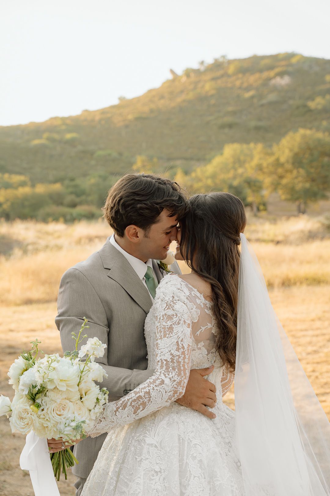 A bride and groom share romantic moments in a golden field at sunset, captured in a series of wedding photographs.