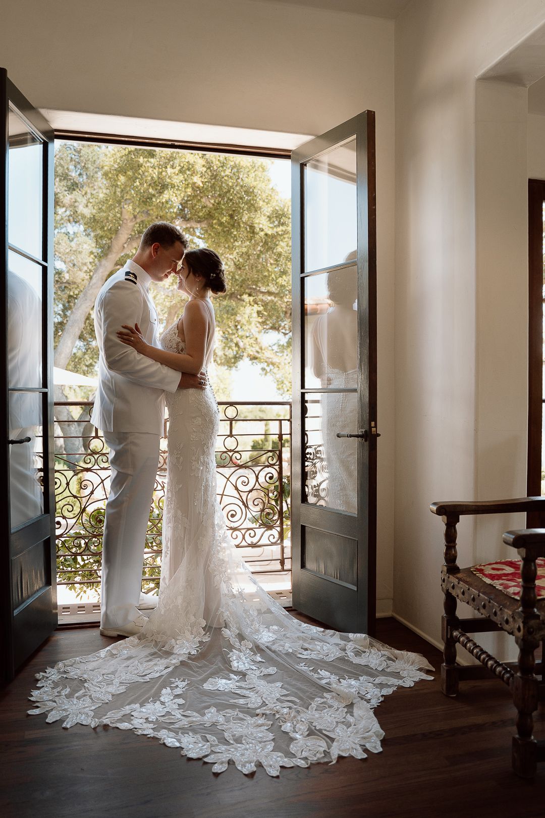 A sequence of wedding dress photos showing the flowing train and natural light streaming through French doors onto hardwood floors.