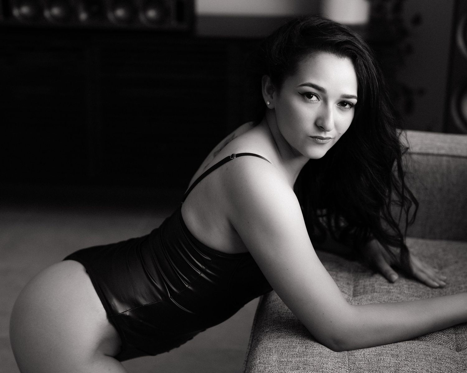 Low key black and white portrait series with minimalist composition.