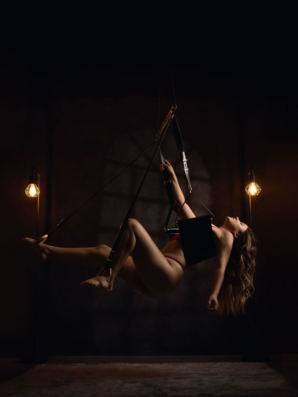 A series of artistic silhouette photos showing legs raised against a dark background with moody lighting.