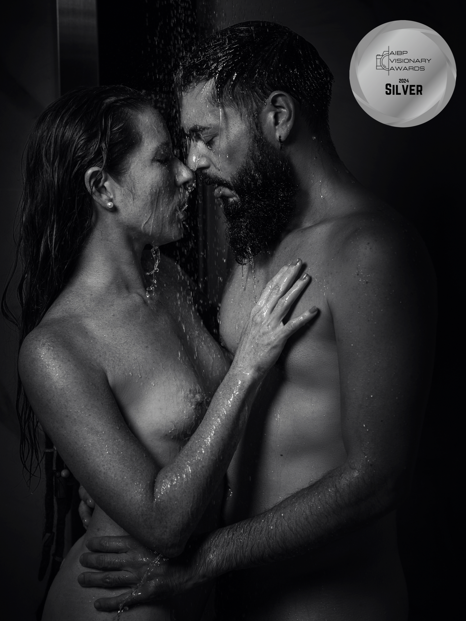 Artistic black and white intimate couple photography series with water droplets and dramatic lighting.