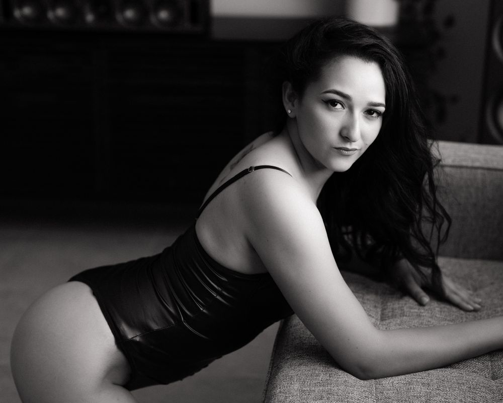 Artistic black and white portrait series with dramatic shadows and poses.