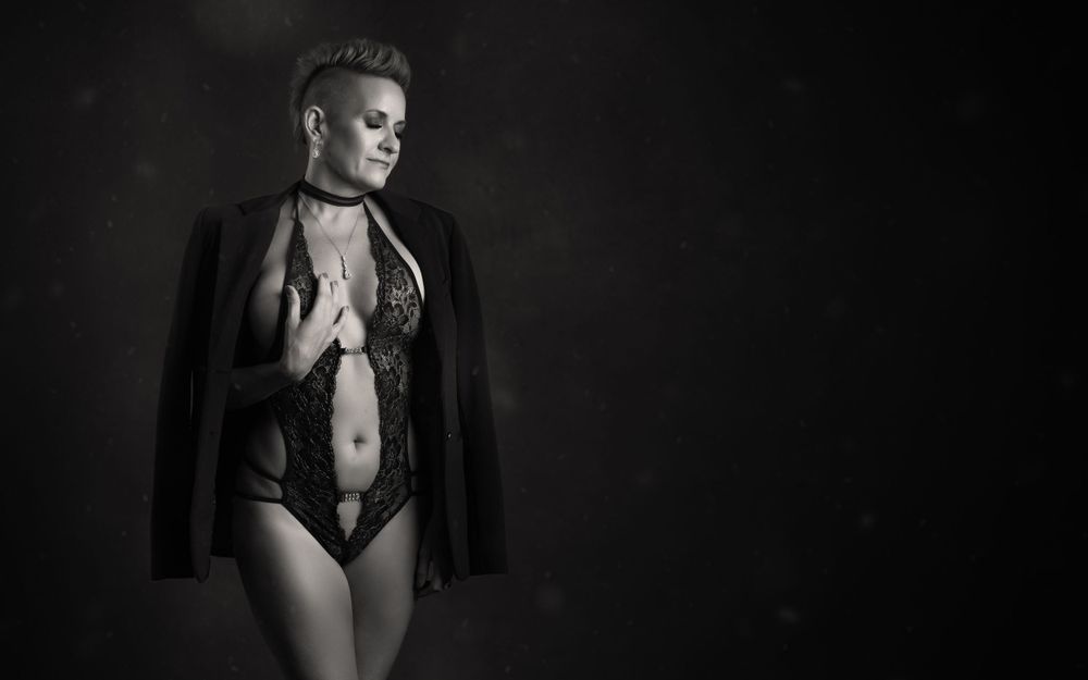 Monochrome fashion portraits with dramatic lighting and jacket styling.