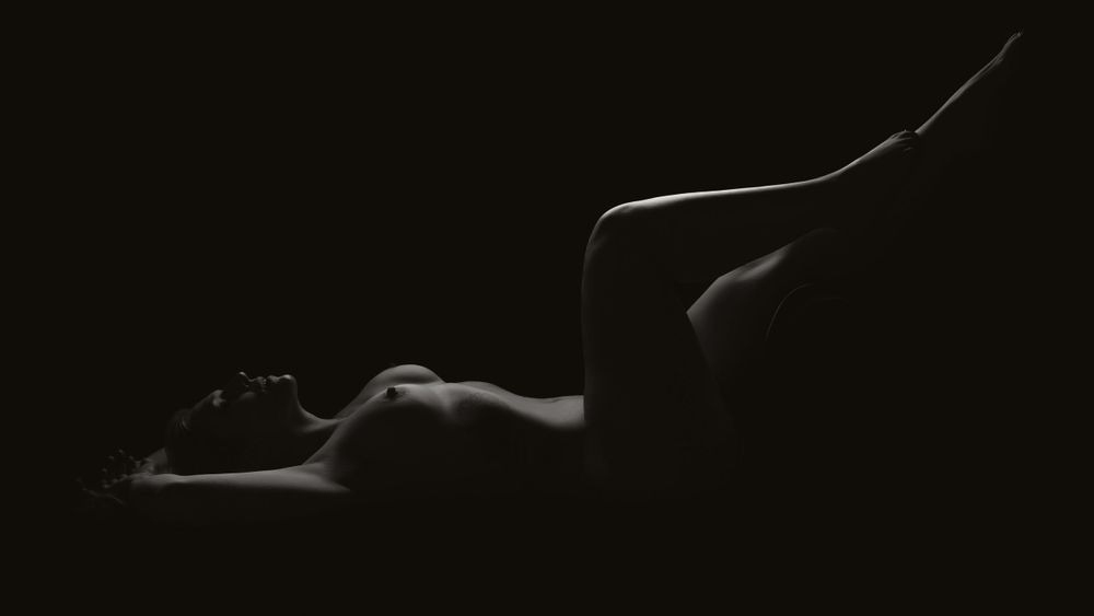 Artistic silhouette photography with dramatic shadows and lighting.