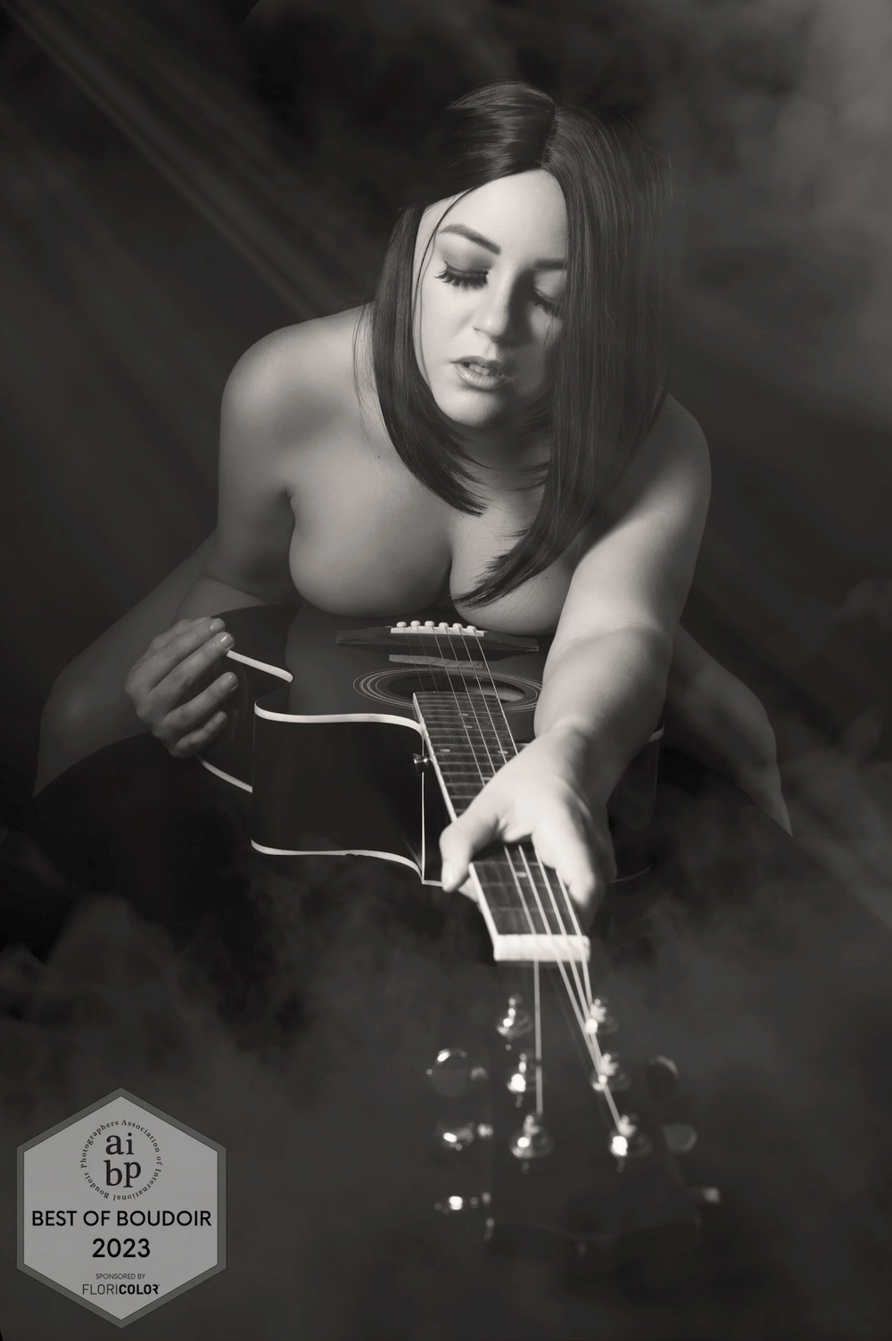 Black and white photo featuring guitar strings and artistic composition.