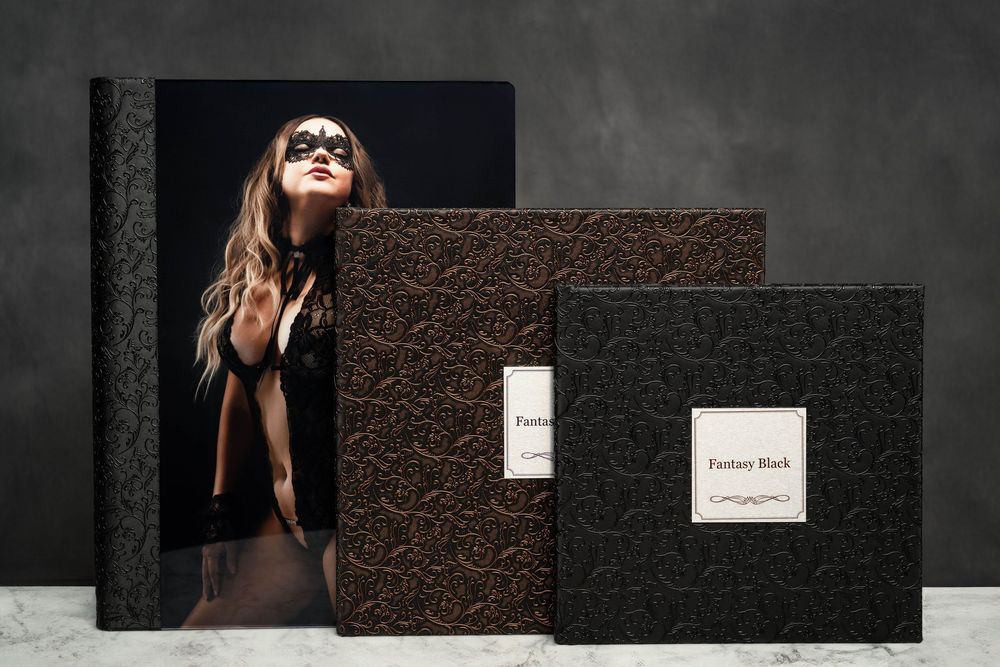 Black and white album presentation with textured background and decorative elements.