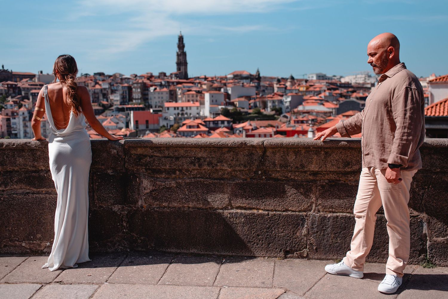 Panoramic cityscapes and architecture create backdrop for outdoor portraits.