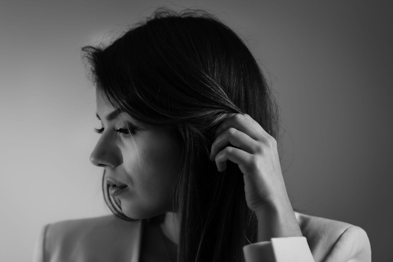 Artistic black and white portrait sequence showing hair movement and texture.