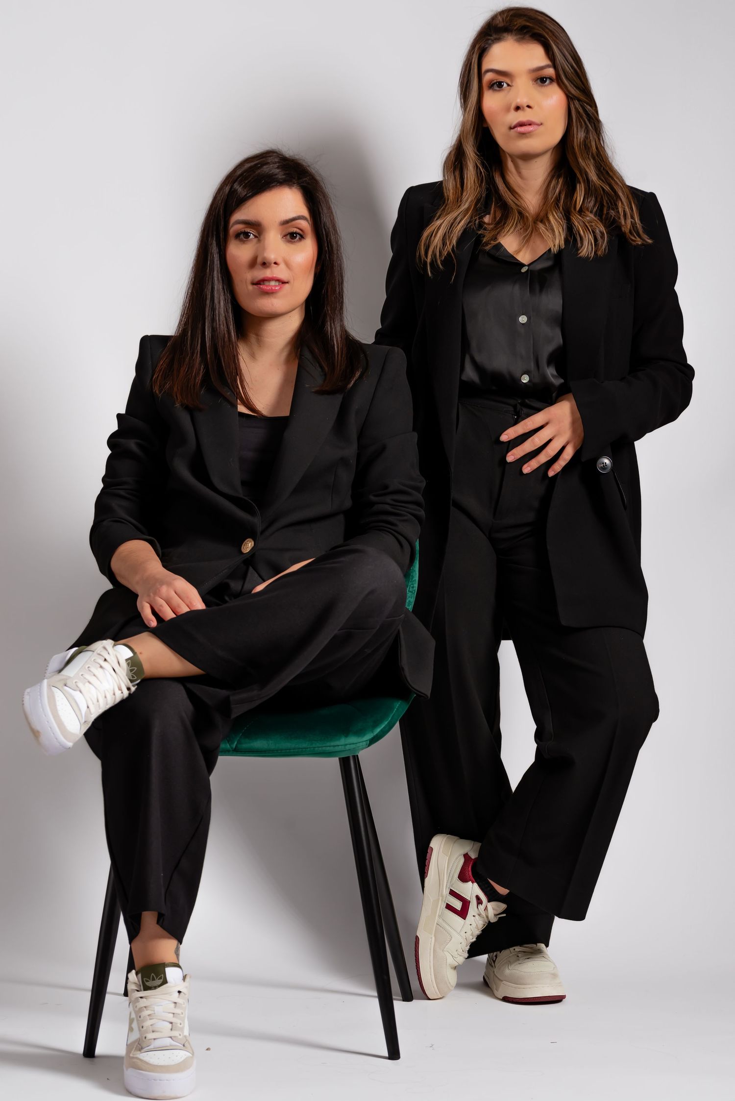 Fashion editorial series showcasing black blazer styling against white backdrop.