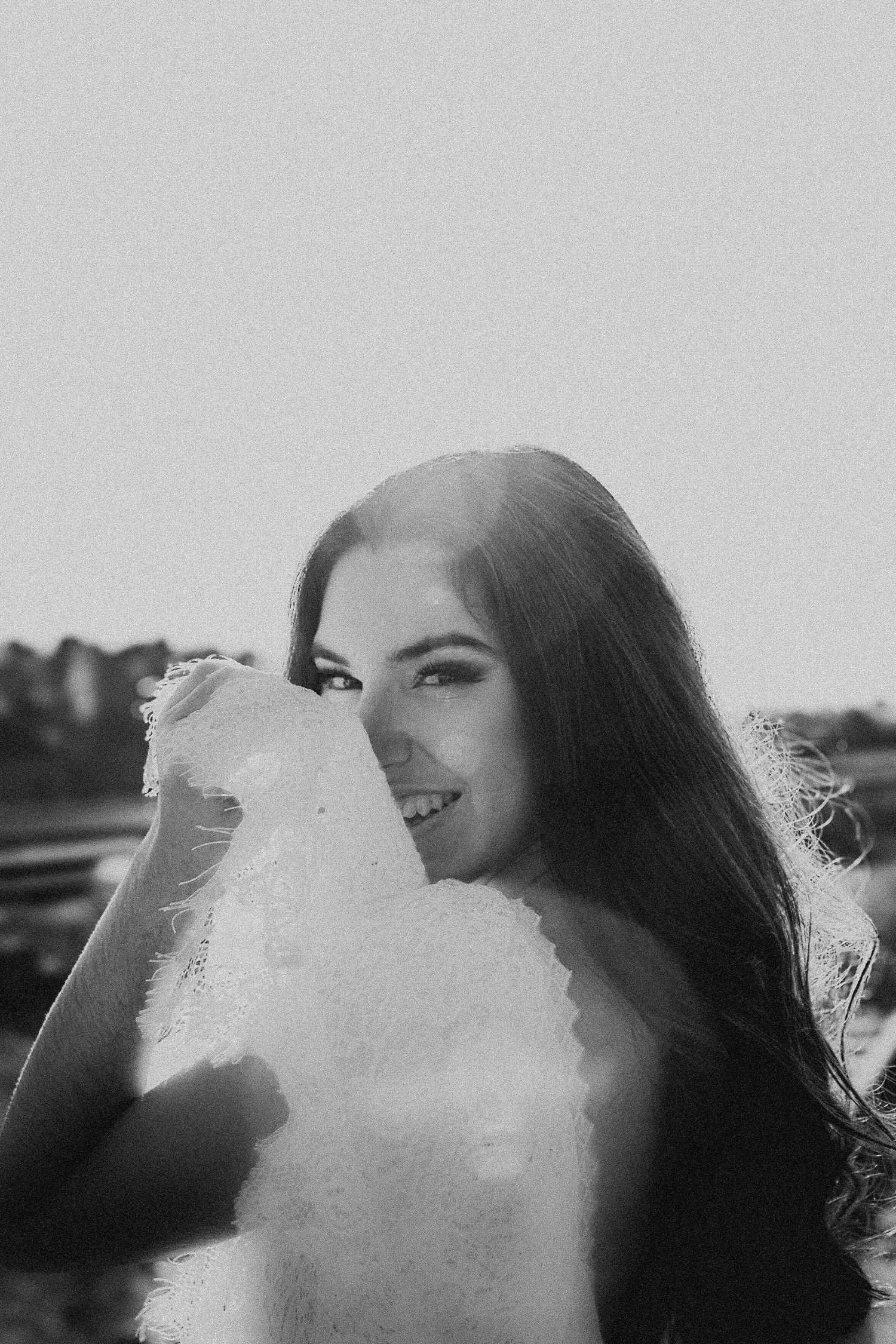 Black and white portrait with soft focus and dreamy lighting effects.