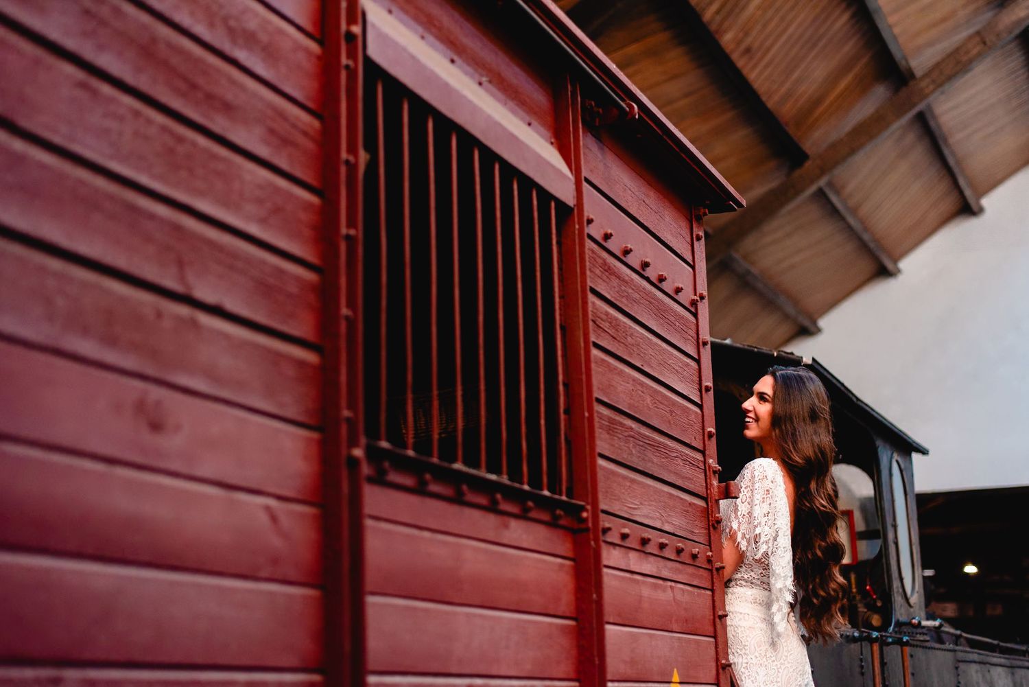Red wooden building exterior with dramatic architectural details in natural lighting.