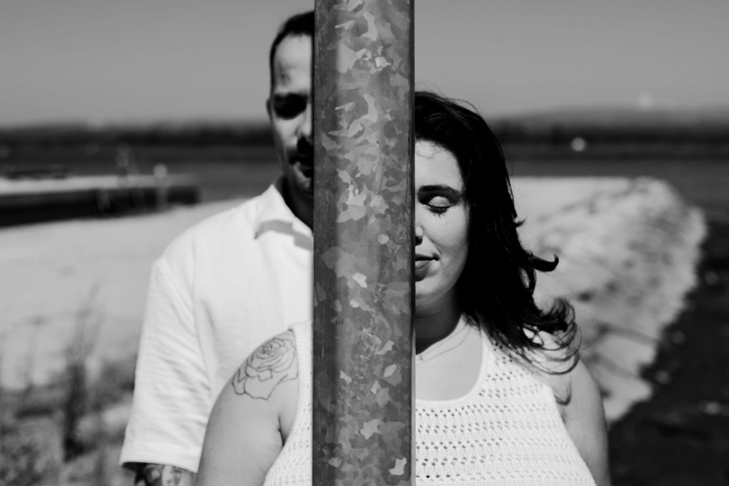 Black and white portrait series with industrial architectural elements.