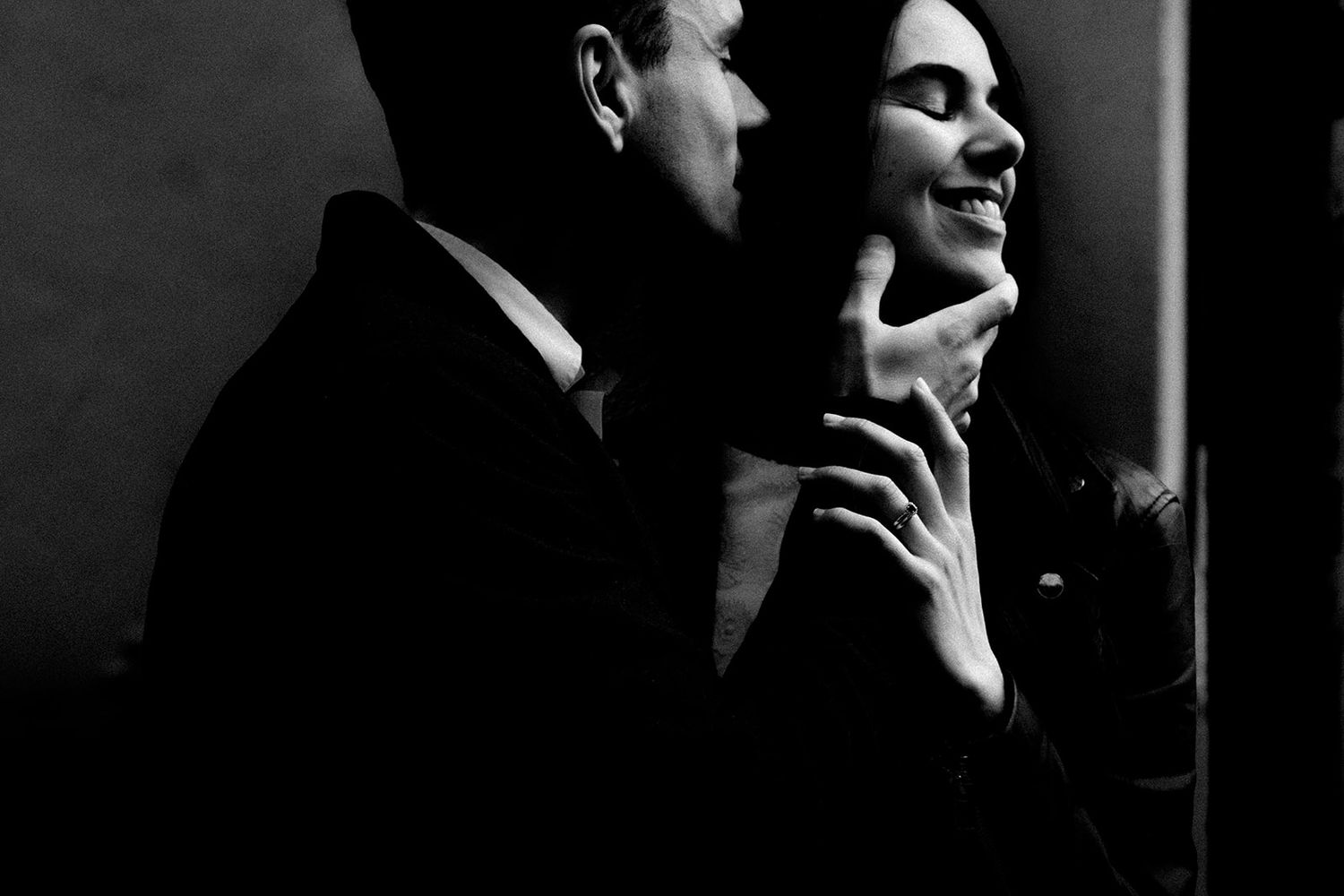 Dramatic black and white portrait sequence showing intimate expressions in low key lighting.