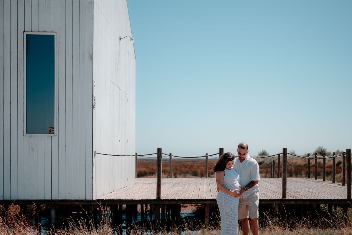 White industrial building provides minimalist backdrop for outdoor photography.
