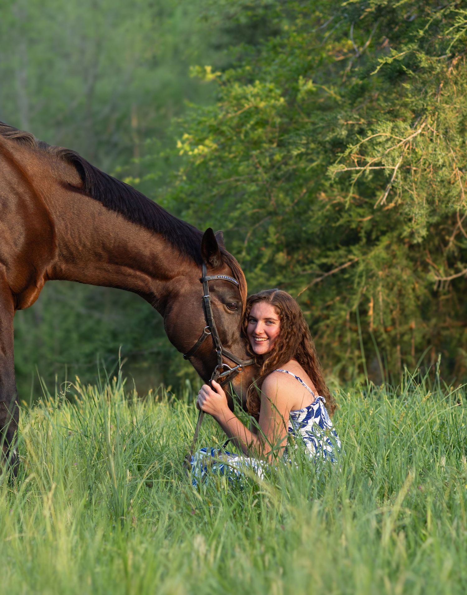Equine photographer captures tender moment between woman and horse in a grassy North Carolina field