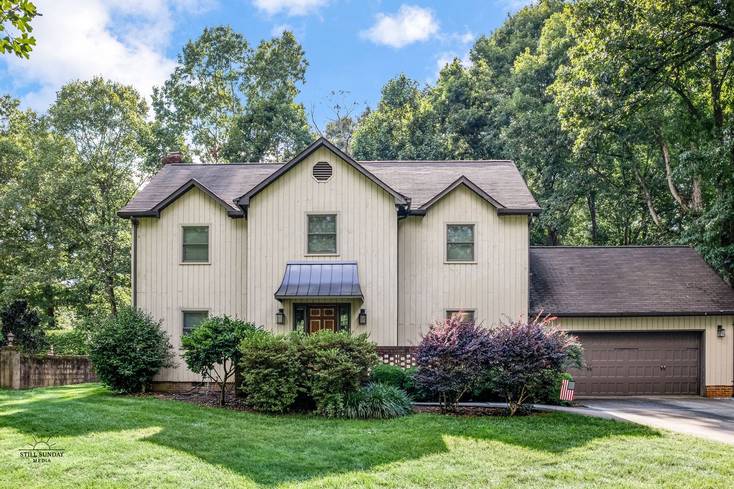 Wide-angle view of a suburban two-story home in North Carolina, captured for real estate listing photography
