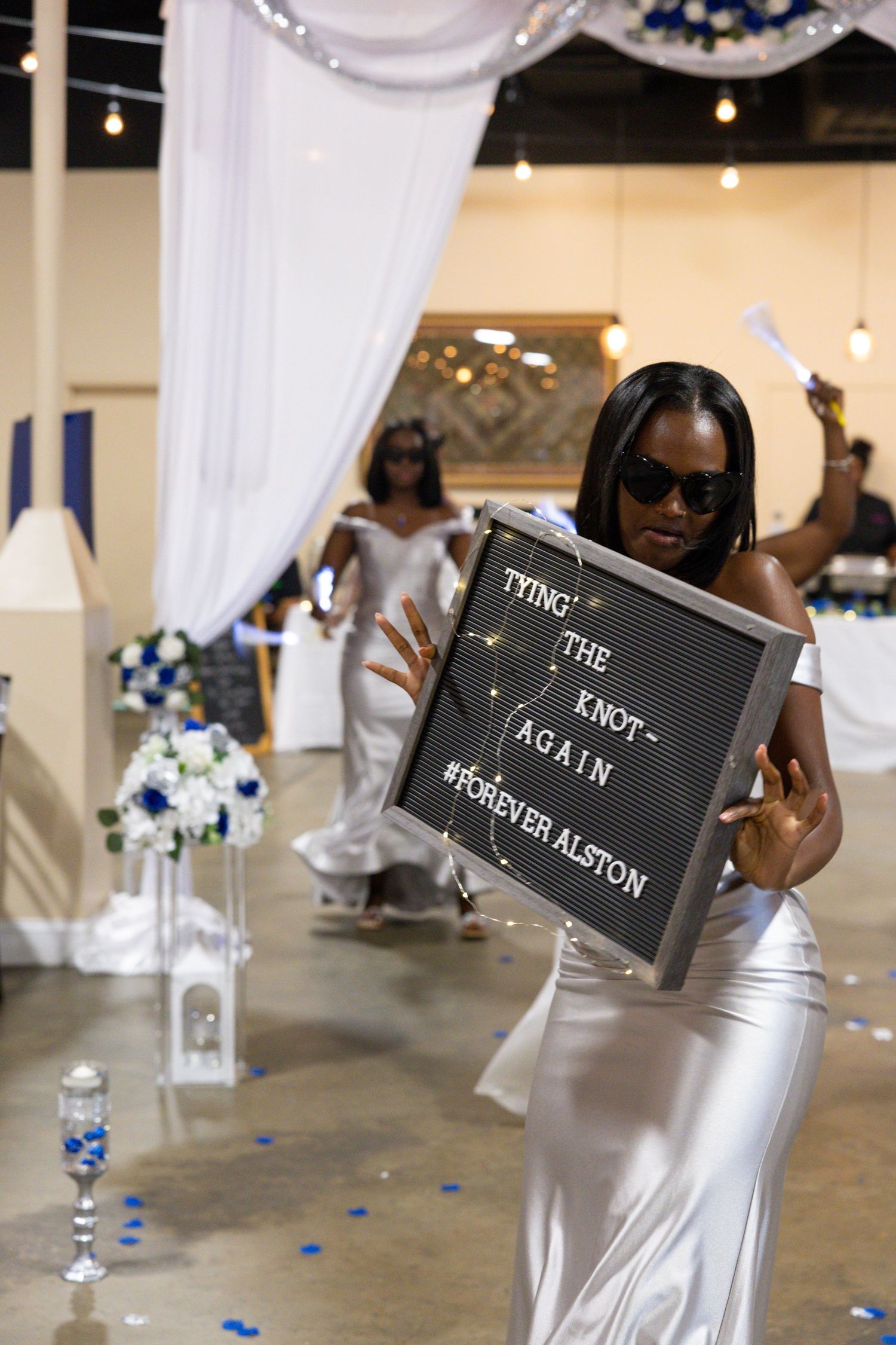 Wedding photo with champagne and custom sign by Charlotte engagement photographer