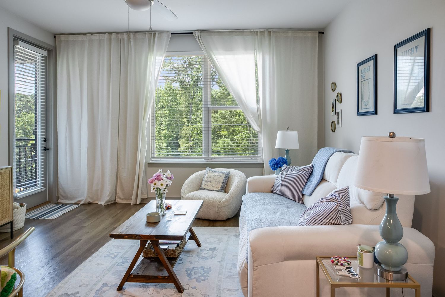 Living room with large windows, natural light, and neutral decor for Charlotte real estate photography