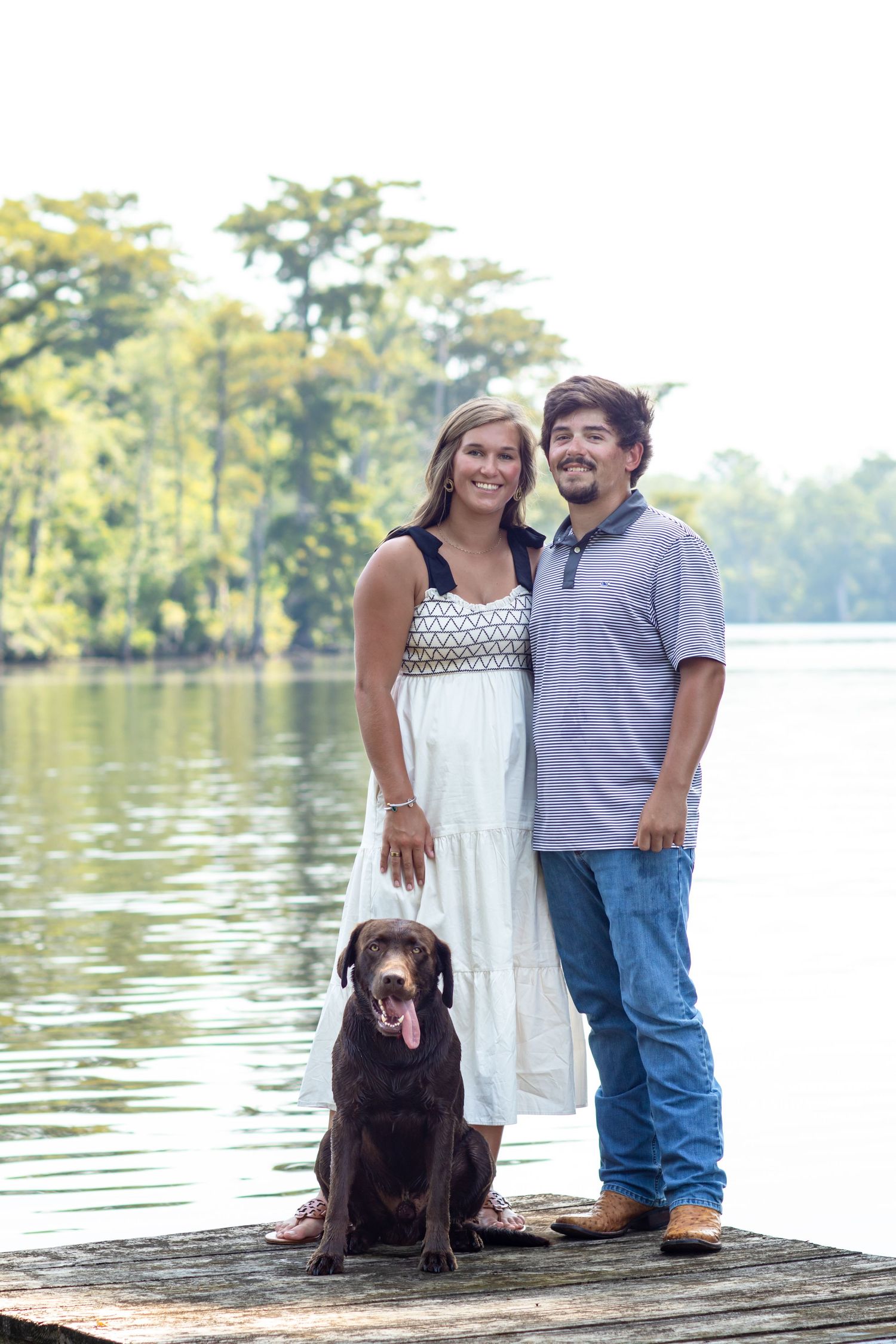 couple portrait session and thier dog by the water