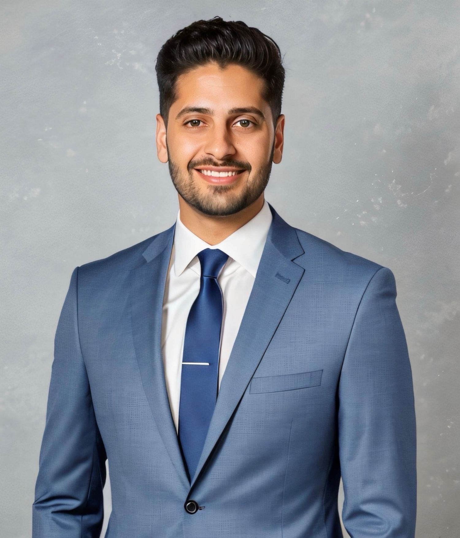 Professional headshot series showing person in navy suit against neutral backdrop.