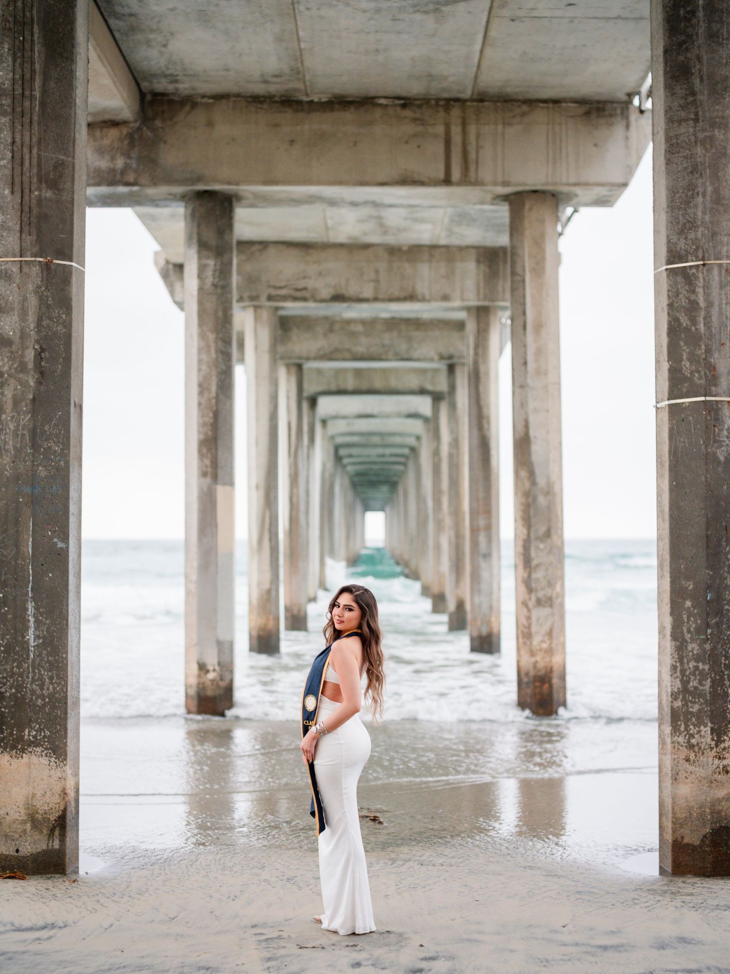 Series of photos under a concrete pier with symmetrical columns stretching to the horizon.