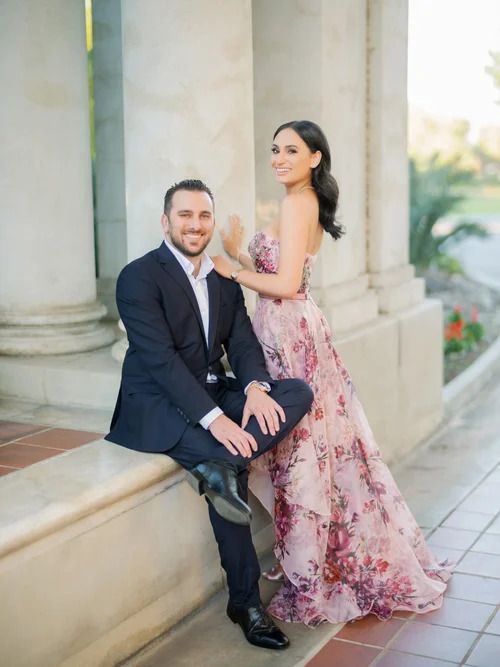 Intimate moments captured along a columned walkway in soft lighting.