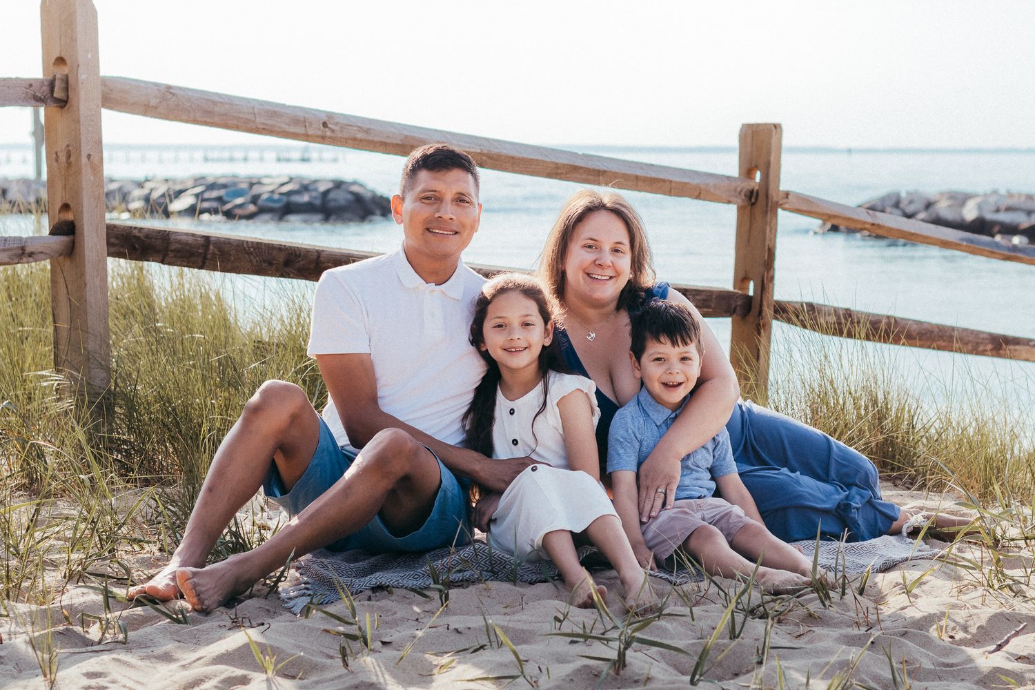 Parents and kids photographed together on a beach in Mayo Maryland