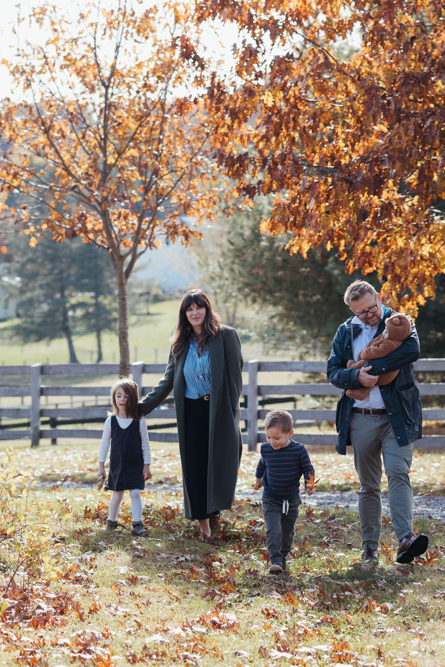 Maryland family photographer capturing parents and children walking outdoors