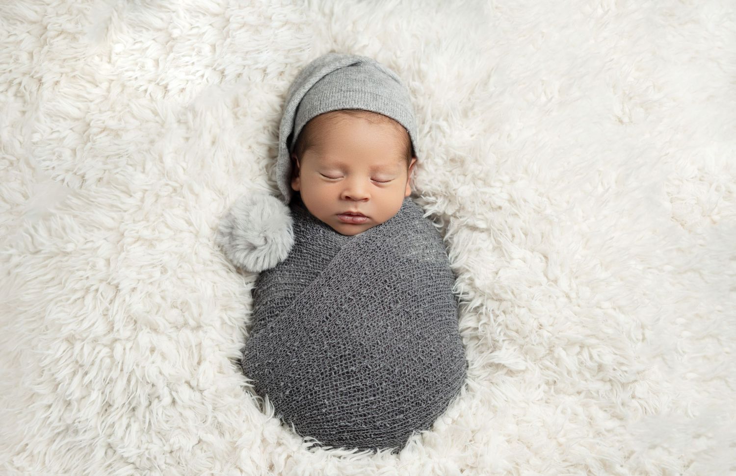 Sleepy baby boy in sleepy cap. Newborn photography baby boy. Best newborn photographer in Cypress, CA.