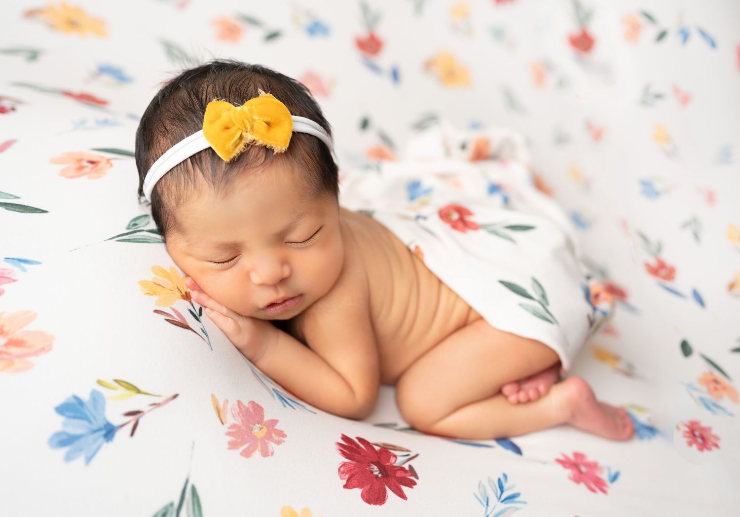 Floral prints for newborn photography. Baby girl in florals. Specialize in newborn photography in orange county