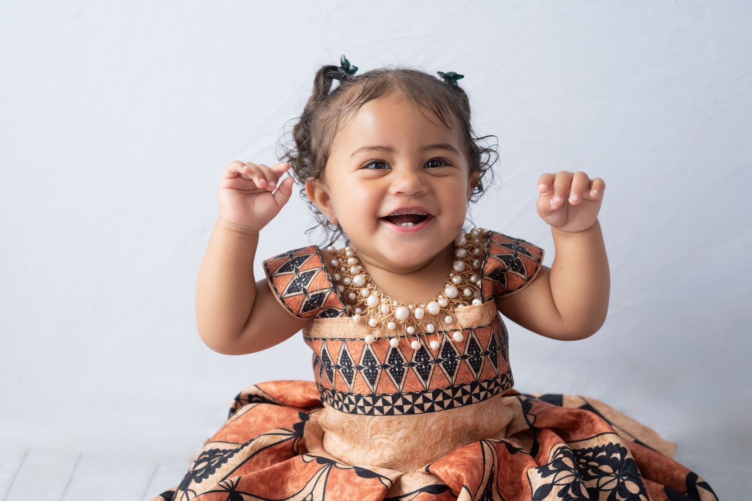 Happy girl on her first birthday. Big smiles photography. Best newborn photographer in Huntington Beach.