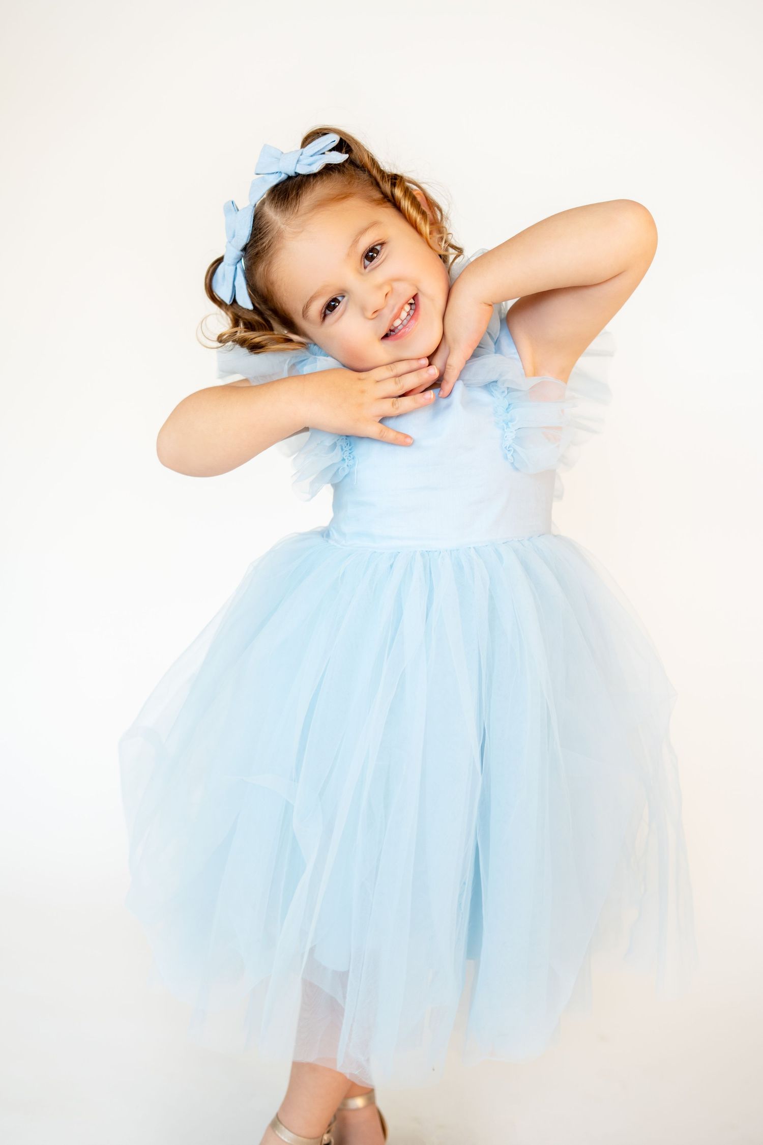 Milestone photography. Little girls turns 4 and looks like cinderella in her blue dress.