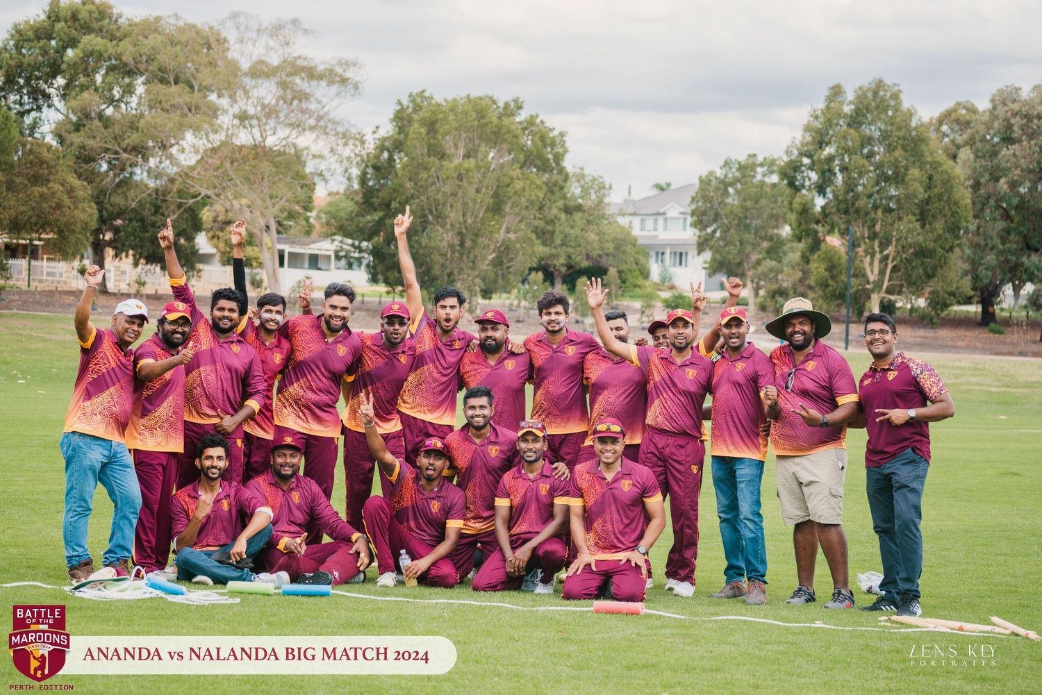 Large group of cricket players celebrating victory in maroon uniforms at Ananda vs Nalanda Big Match 2014.