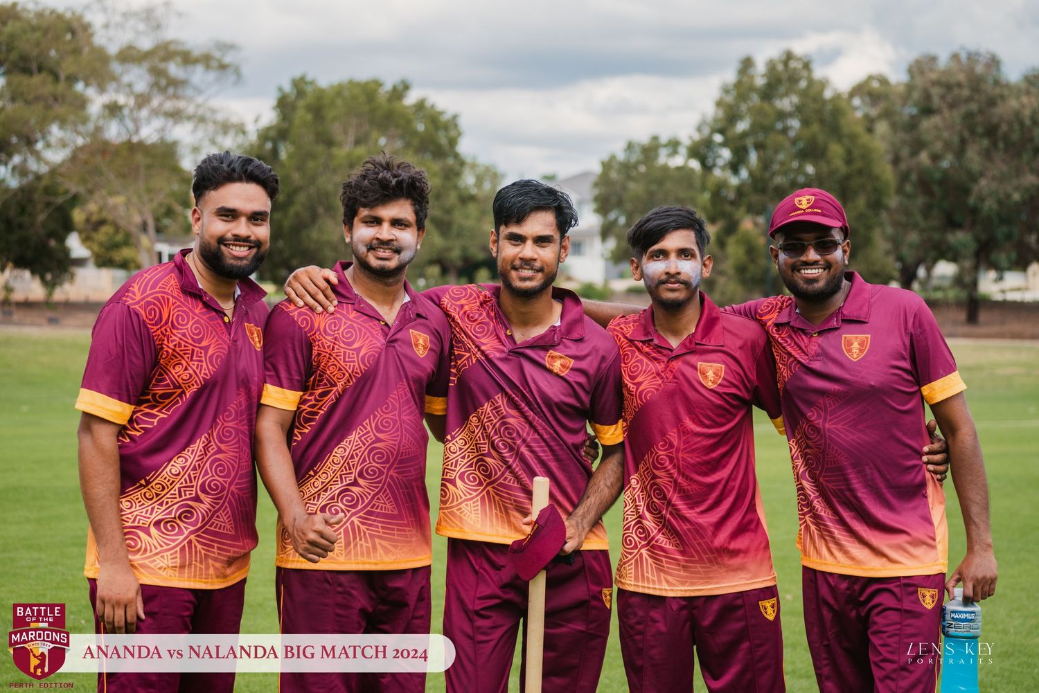 Five smiling cricket players posing together in maroon uniforms at Ananda vs Nalanda Big Match 2014.