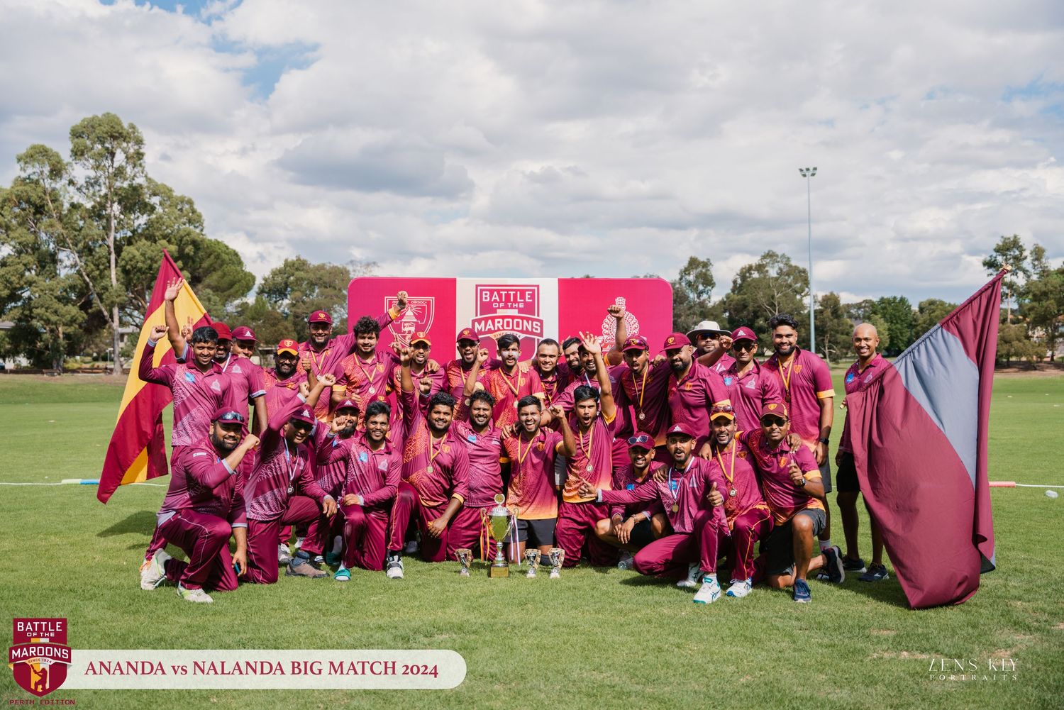 Cricket team in maroon uniforms celebrating victory at the 2024 Ananda vs Nalanda Big Match.
