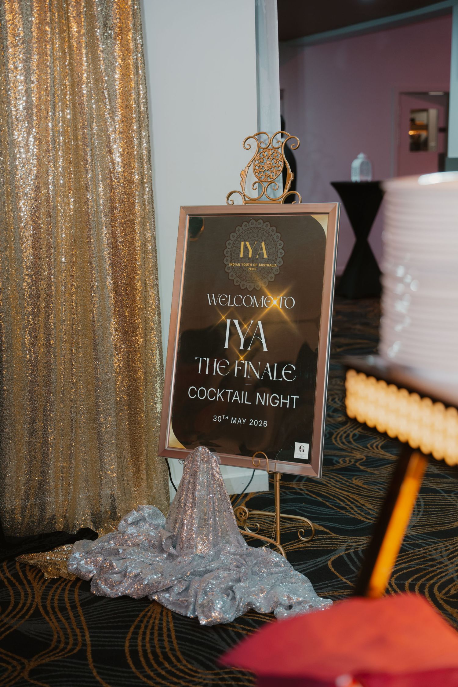 Welcome sign for IYA The Finale Cocktail Night event dated 30th May 2026 with gold decor.