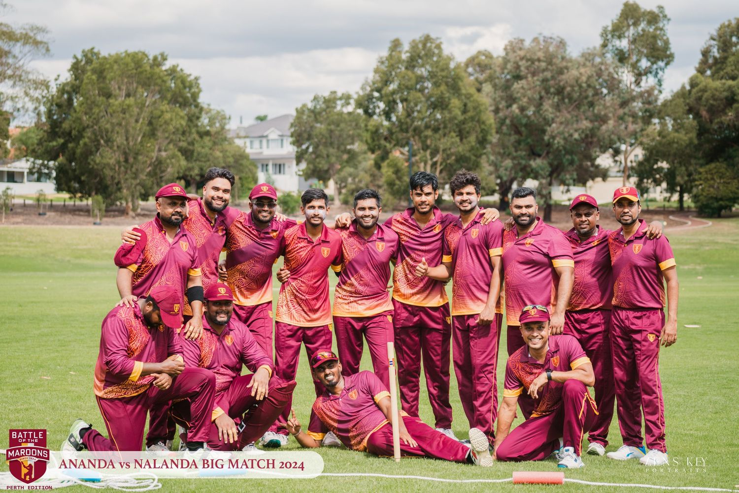 Cricket team posing together in maroon uniforms for team photo at Ananda vs Nalanda Big Match 2014.