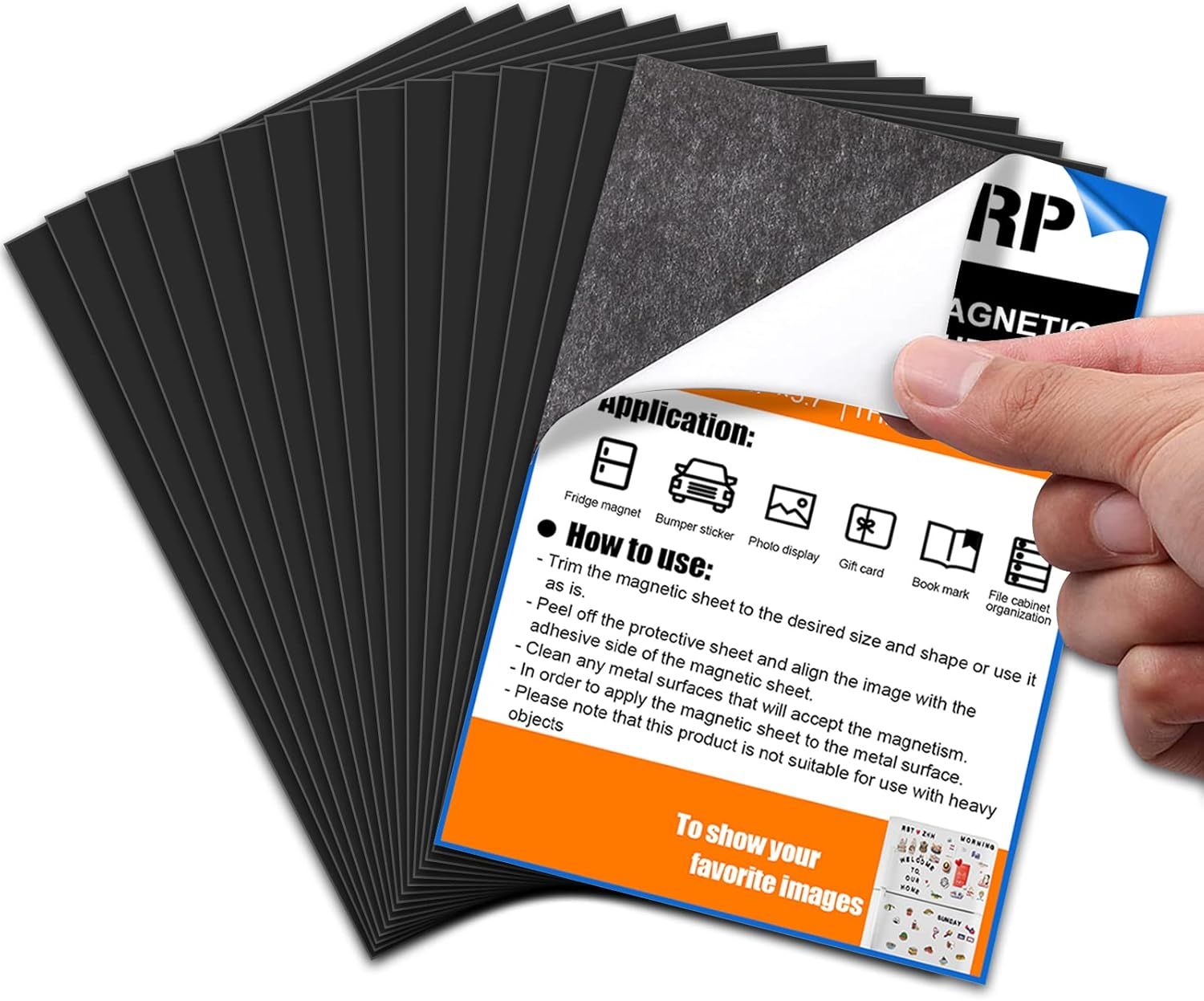 Stack of carbon transfer paper sheets with a hand holding a product instruction card showing usage icons.