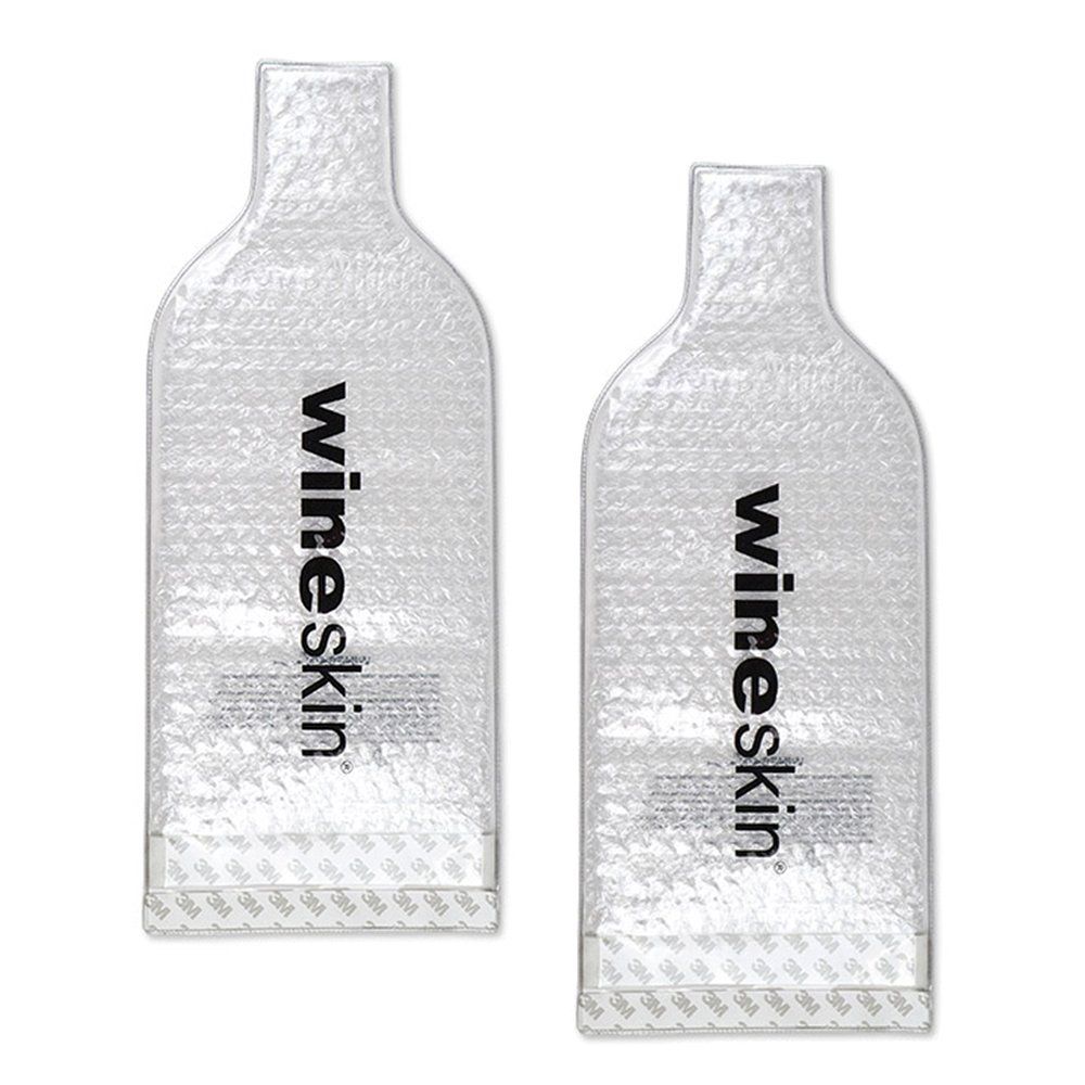 Clear glass liquor bottles arranged in a row showing reflective surfaces and transparent design elements.