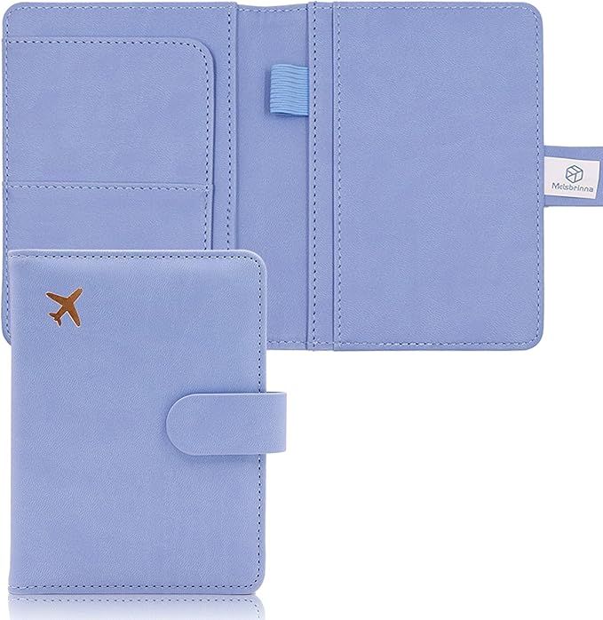 Light blue leather passport holder with airplane icon and snap closure showing interior card slots and pockets.