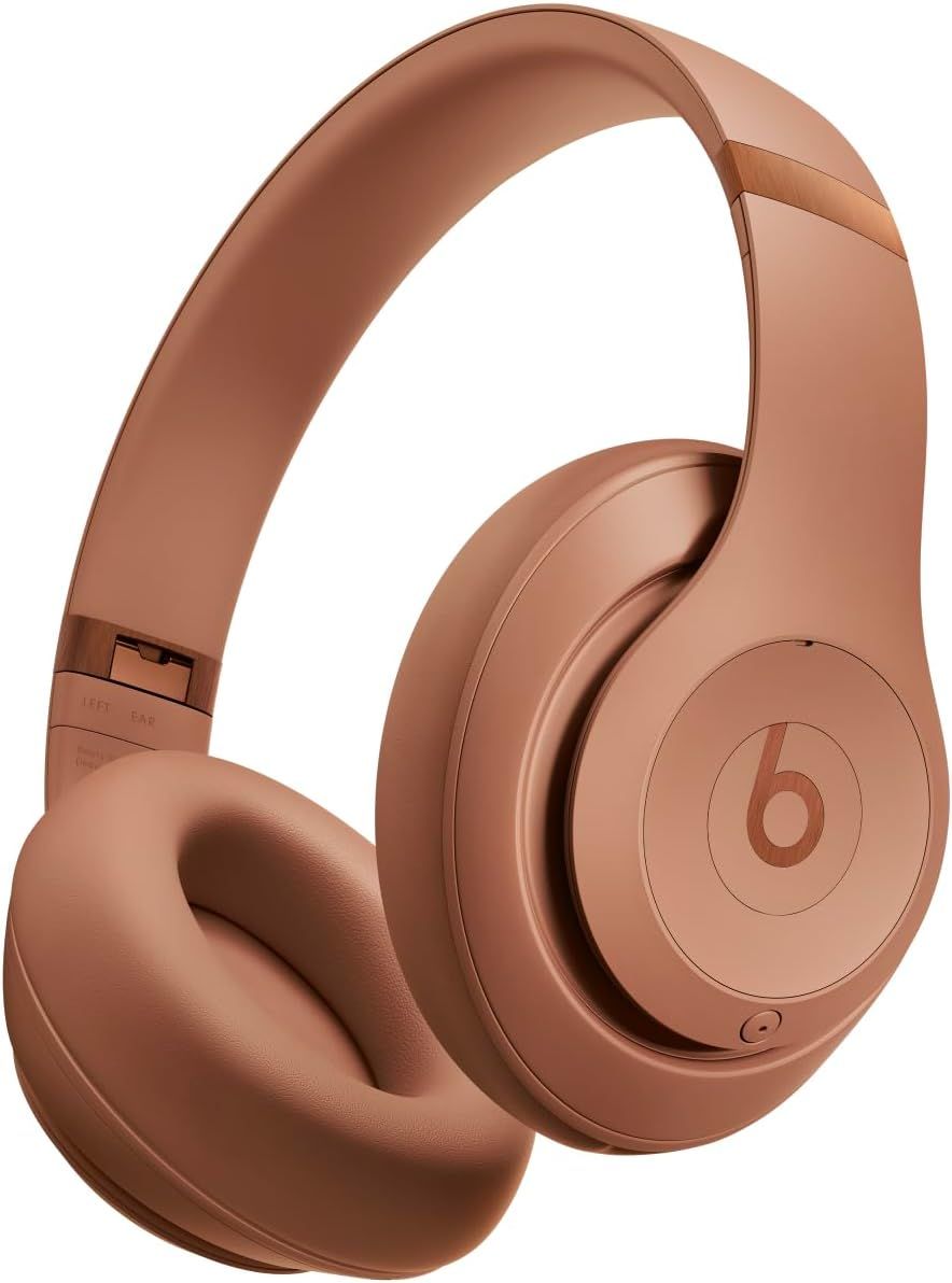 Beats wireless over-ear headphones in a stylish matte rose gold finish with cushioned ear cups.