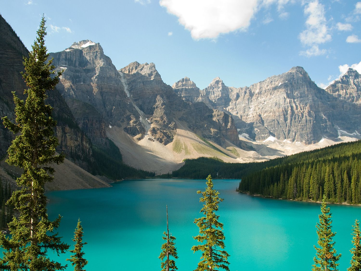 Turquoise waters of Moraine Lake surrounded by the Valley of Ten Peaks in Banff National Park.