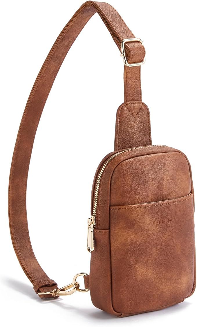 Brown leather sling bag with gold zipper and adjustable strap featuring a sleek minimalist design.