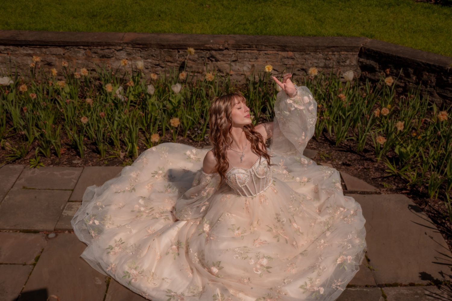 Scenic outdoor wedding ceremony features elegant decor and floral arrangements under natural lighting.
